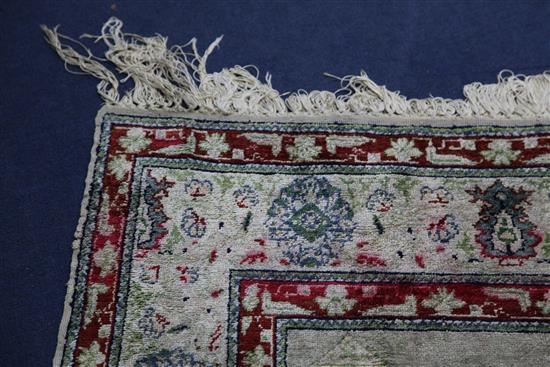 A Panderma part silk pale green/grey ground prayer rug, 5ft 4in by 3ft 6in.